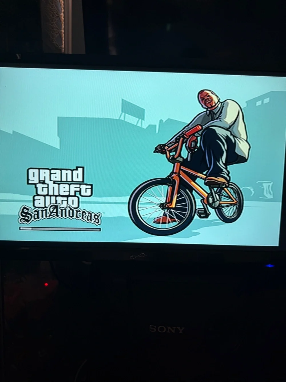 Sony PlayStation 2 Slim with Teal Transparent Controller and GTA: San Andreas